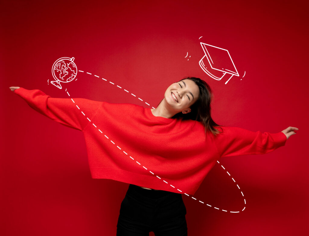 Woman posing with graduation background.